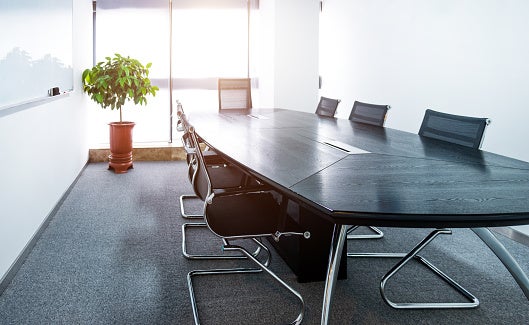Used conference table and chair setup in office in Houston, TX